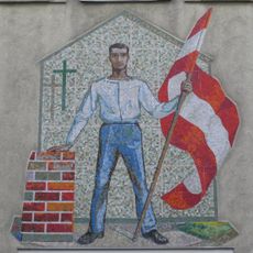 Arbeiter mit rotweißroter Fahne