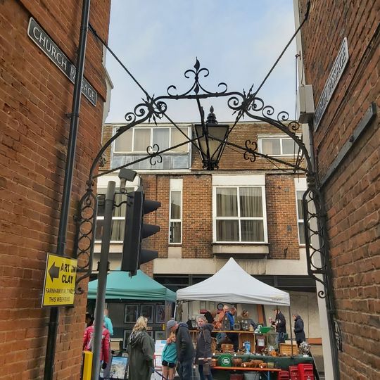 Overthrow And Lamp Bracket Attached To Numbers 15 And 16; Also Lamp