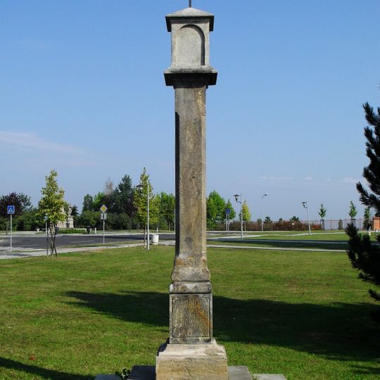 Plague column close to the Church of Assumption of Virgin Mary in Most