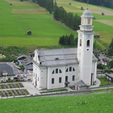 Parish Church St. Peter and Paul with cemetery chapel and cemetery in Sexten