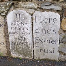 3 Adjacent Roadside Milestones Set In Middle Of Stone Wall Approx 18M West Of Lambert Lane Junction