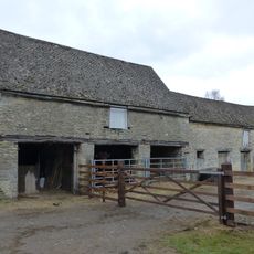 Cartshed and granary with attached cowhouse across road and to south east of Manor Farmhouse