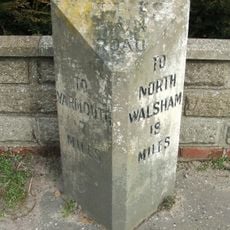 Milestone, High Road, by Bastwick House,