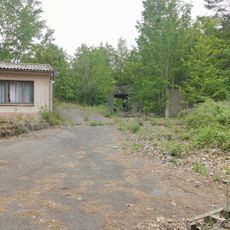 Eleven bunkers along a road, a single bunker, five warehouses and a wall with watchtowers on Bundesstraße 27