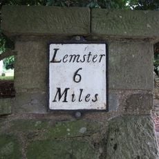 Milestone, by N entrance to churchyard