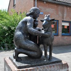 Moeder met kind en bok