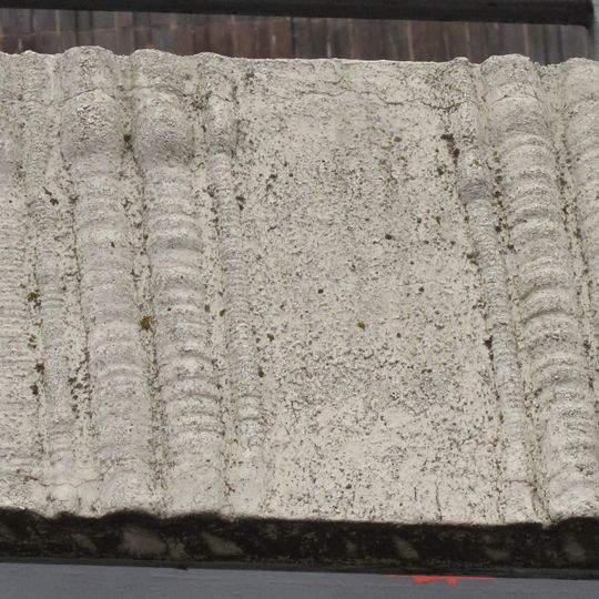 Concrete relief on the railing of the Dornych shopping center