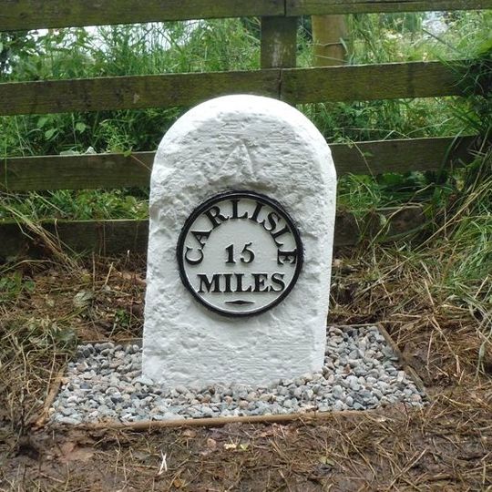Milestone, SE of Penton House, jct with  UC road to Watleyhirst