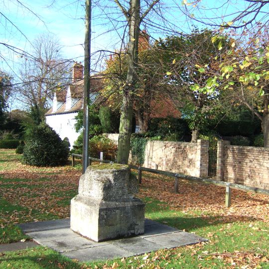 Base of Village Cross, opposite The Grange