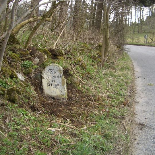 Milestone, a mile SW of Longcliffe, in chicane in road