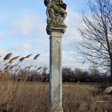 Figurenbildstock, sog. Bürzelnkreuz oder Piazollkreuz