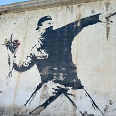 Man Throwing Flowers by Banksy