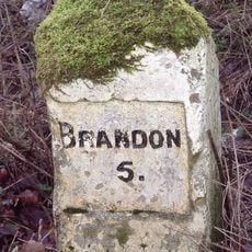 Milestone, 100m S of entrance to caravan park at Methwold Warren