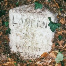 Milestone, Gravel Hill; 50m S of jct with Copthall Lane, beside drive to Azania