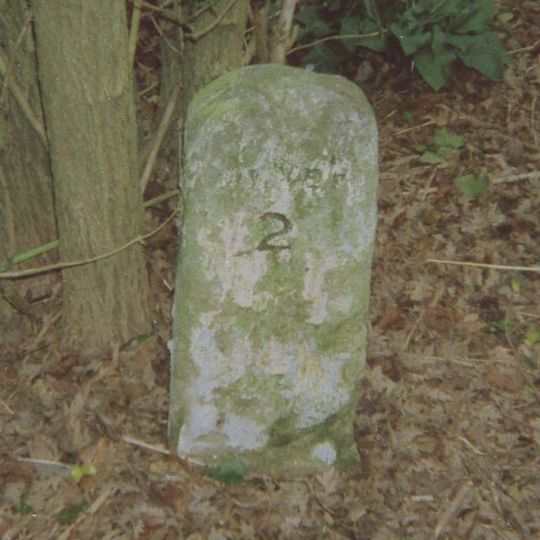 Milestone, Guston, E of tree screen to Duke of York's Royal Military School, quarter mile S of A2 jct