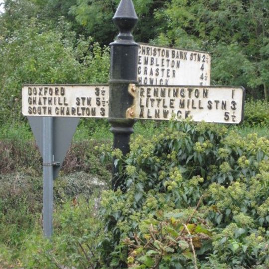 Signpost At Road Junction South Of Rock Farm