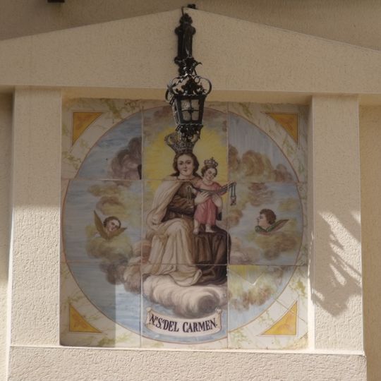 Ceramic panel of Our Lady in Mount Carmel at 2 Rosario street