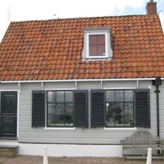 Houten dwarshuis met houtskelet. Uitwendig aspect, met 9-ruitsvensters, 19e-eeuws