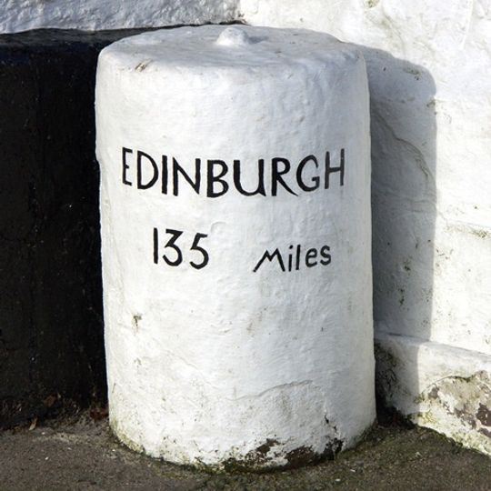 Milestone, Highgate main street; by Highgate Hotel