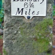 Milestone, Banbury Road; Swerford Heath, 50m W of lane to Heath Farm and 150m E of old toll house