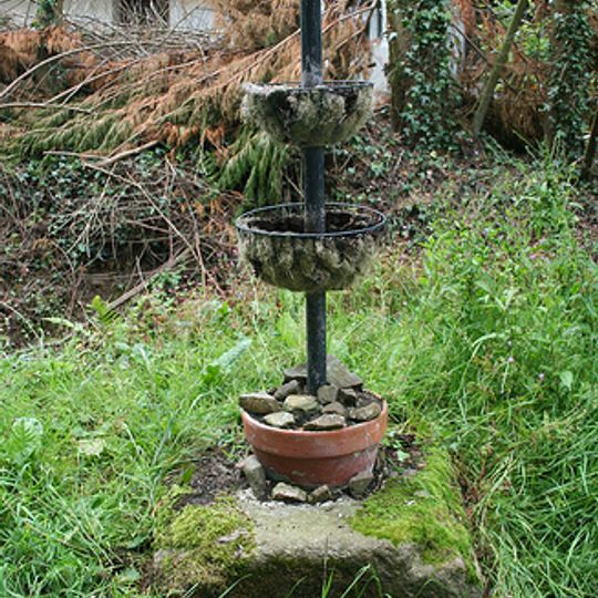 Wayside cross socket stone  at road junction 70m east of St Peter's Church