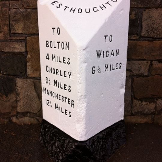 Milestone, Bolton Road, opp. No. 234 , 140m from the jct with the A6 Manchester Road