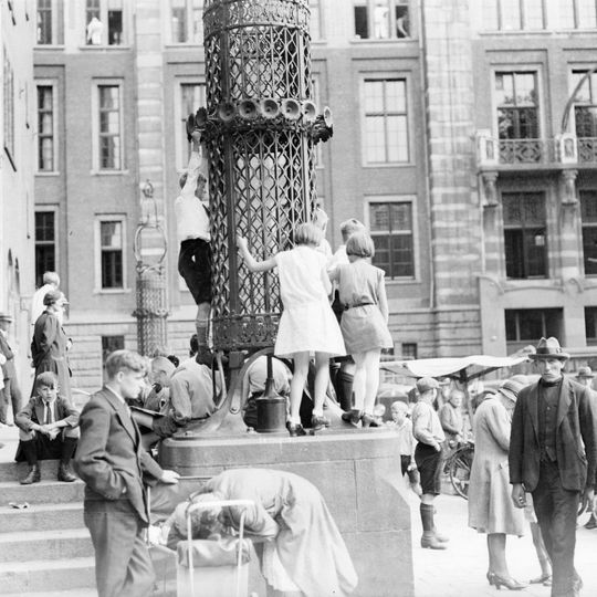 Street lanterns and fountains at Beursplein, Amsterdam