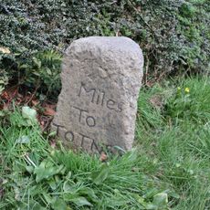 Milestone, 300m W of railway bridge, Culver; just N of "Bradleigh"