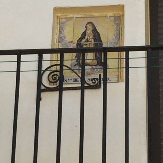 Ceramic panel of Our Lady of Solitude at 31 Corazón de Jesús street