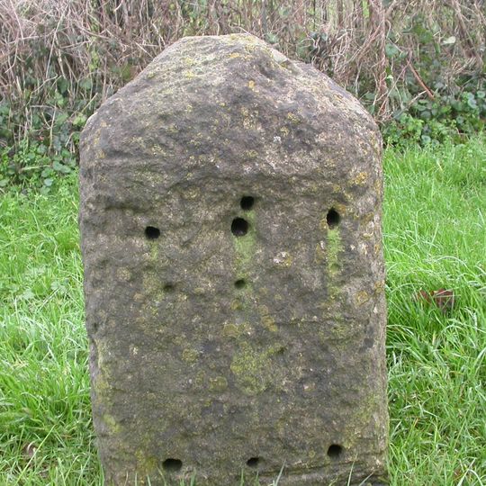 Milestone, Shaw; 65m E garden centre