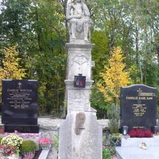Tombstones and sculpture of the Man of Sorrows