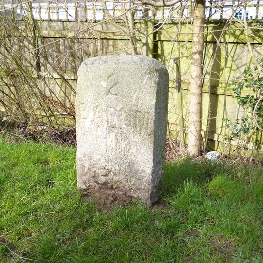 Milestone, Old Bideford Road, Roundwell, opp. Hazeldene, by bus stop, 20m W of Meadow Brook jct