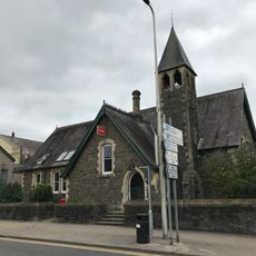 Former Priory Street School with walls and railings