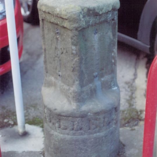 Milestone, Main Road, Galgate, opp. No. 35 beside Car sales lot