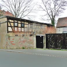 Wohnstallhaus, Scheune und Seitengebäude eines Bauernhofes Melzerstraße 10