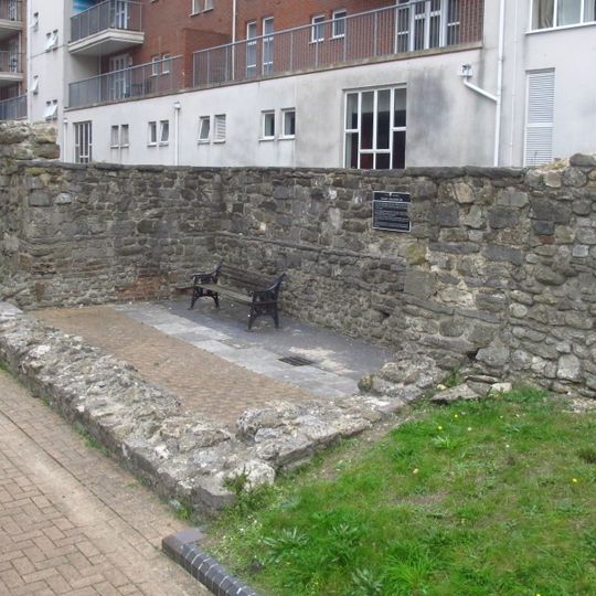 Town wall: remains of E side of town wall S of East Street and N of Gods House Tower