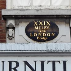 Milestone, High Street, on No. 25, N of George Lane