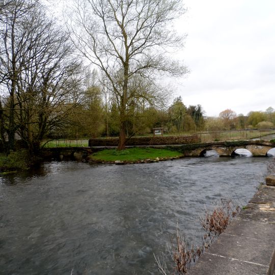 Two bridges over River Coln and mill stream approximately 30 metres west of Number 10 (Bridge House)