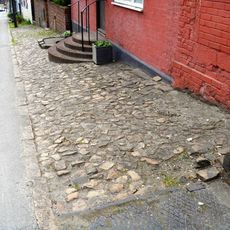 Pavement Running From In Front Of Number 5 To Just Past Number 9