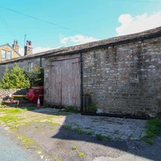 West Gate Farmhouse With Barn Attached To Right