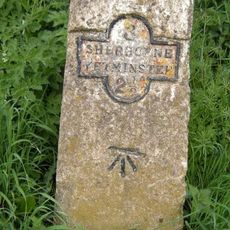 Milestone, just E of the village