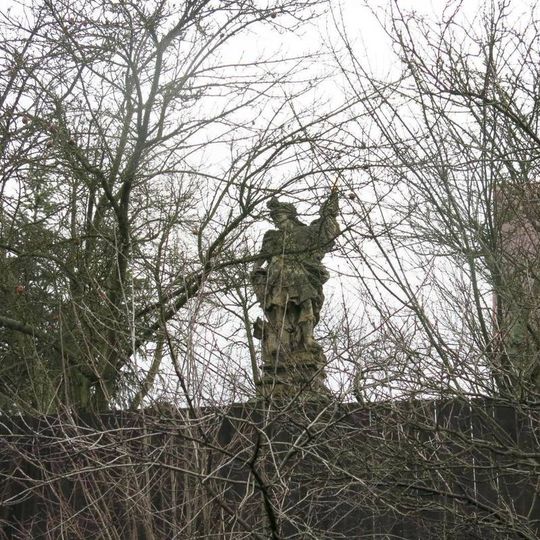 Socha svatého Floriána v zahradě domu 249 v Úštěku