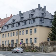 Wohn- und Gewerbegebäude mit Hinterhaus, Seitengebäude und vorgelagerter Heiste Freiberger Straße 15