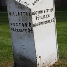 Milepost, centre of village