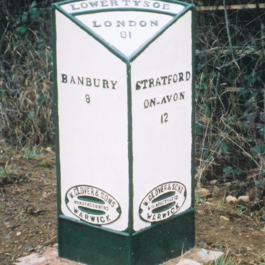 Milepost, bottom of Sun Rising Hill, on jct of UC road to Tysoe