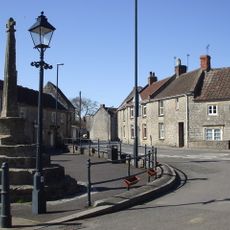 Village cross to west of Church of St Peter