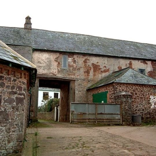 Gatehouse and barn abutting west end at Bratton Court