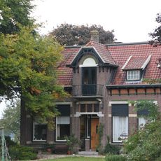 Boerderij met dubbel woonhuis en bedrijfsdeel met staart