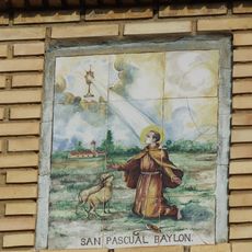 Ceramic panel of Saint Paschal Baylon at 28 Sant Pasqual square