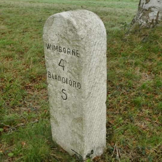 Milestone, half mile W of Badbury Rings;
